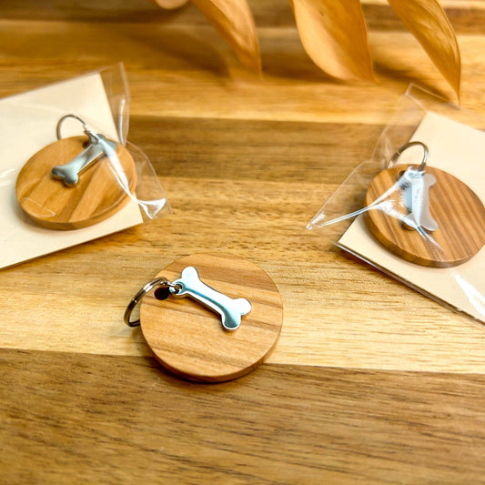 3 wooden tags with silver bone charm